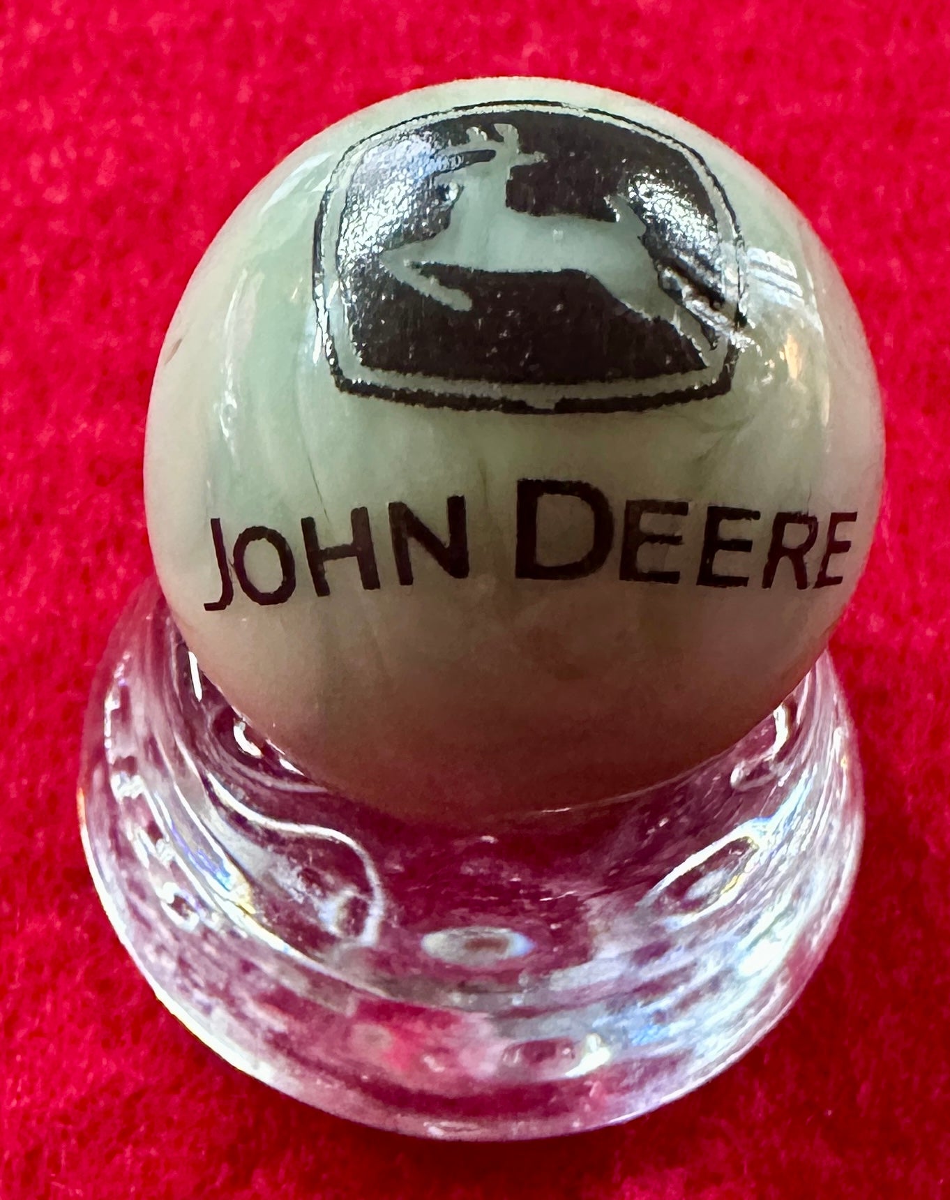 Lot of 3 Collectible John Deere Marbles with one display base